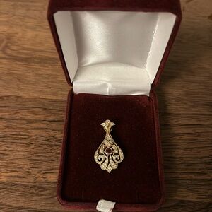 Ruby and diamond pave pendant. 14k gold confirmed by jeweler.